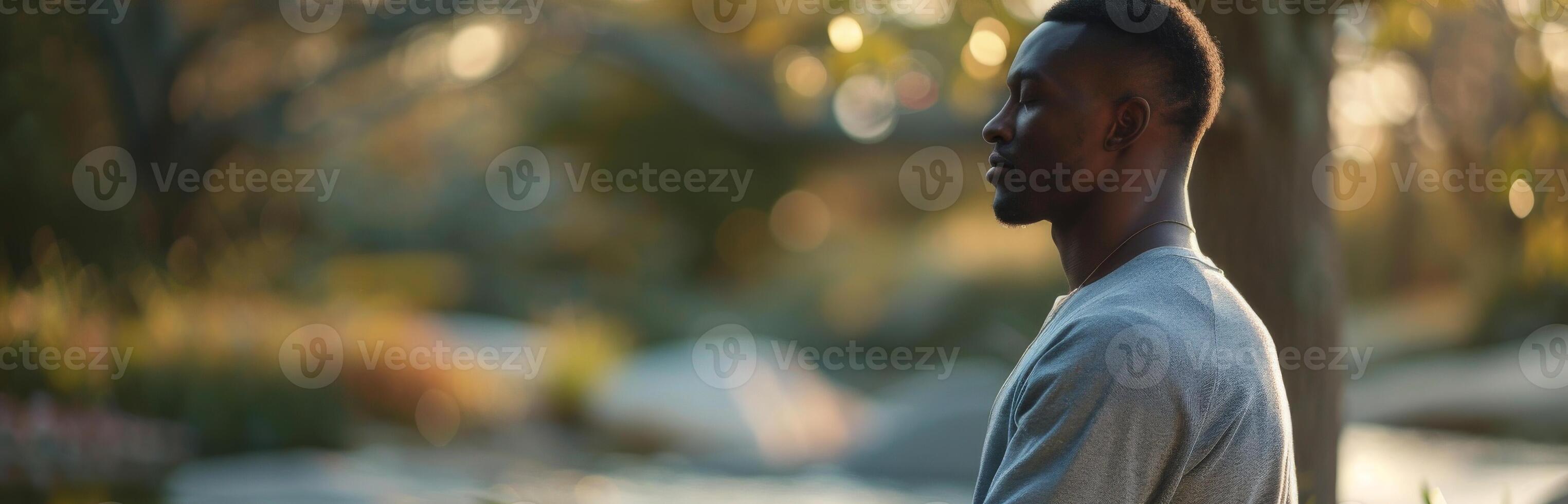 African Man Practicing Mindfulness Meditation in Peaceful Garden photo