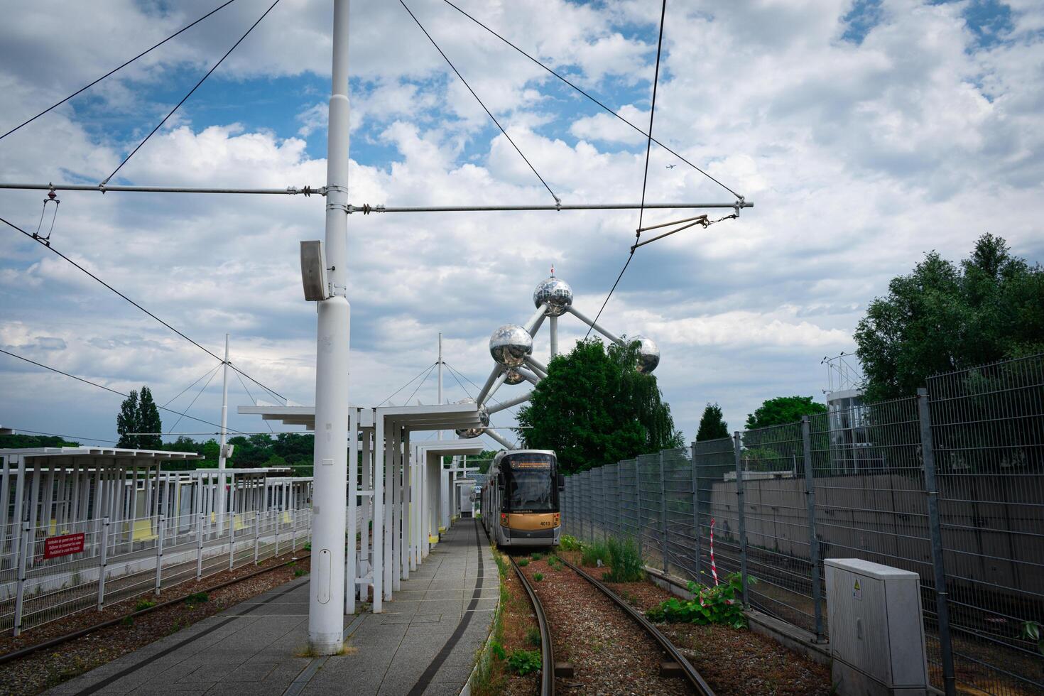 Tram station in Bruxelles city near atomium exposition, a tram is waiting at the station to start a new course photo