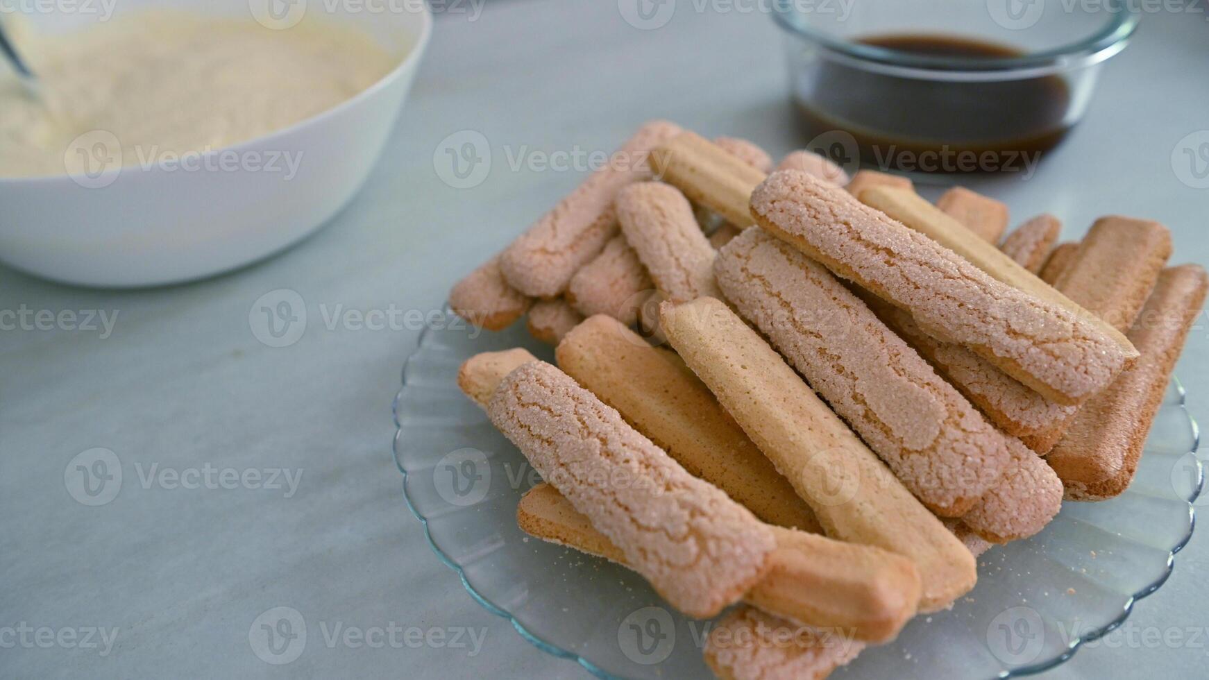 Preparation of ingredients for tiramisu dessert on a kitchen counter photo