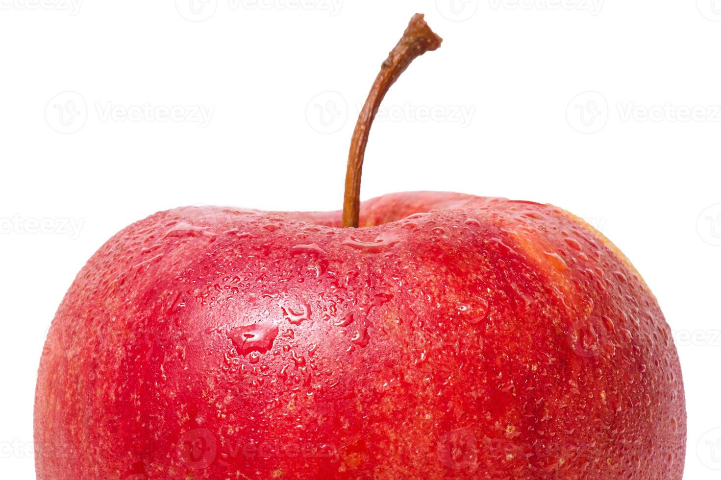 Macro photo of the top half of an apple isolated on a white background. Apple with water drops