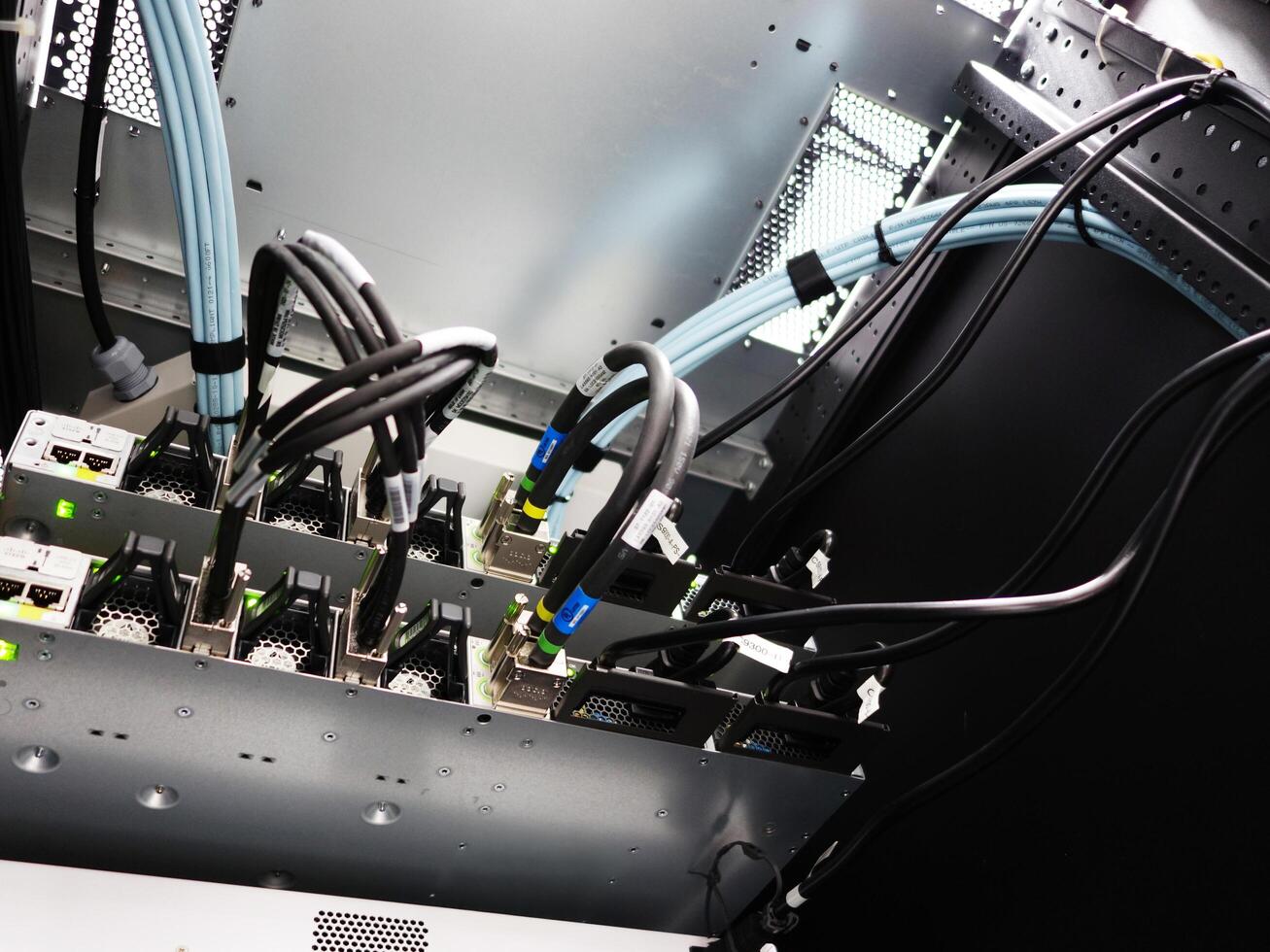 network cables connected to switch - closeup of data center hardware technology photo