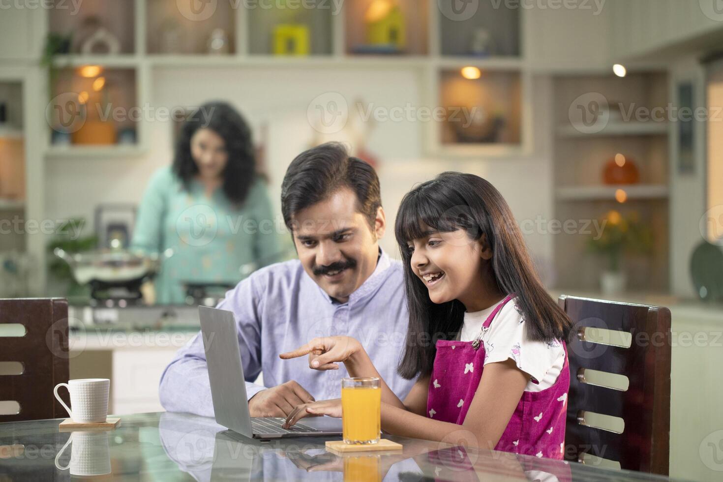 Dad Teaching Or Helping The Daughter To Use Laptop photo