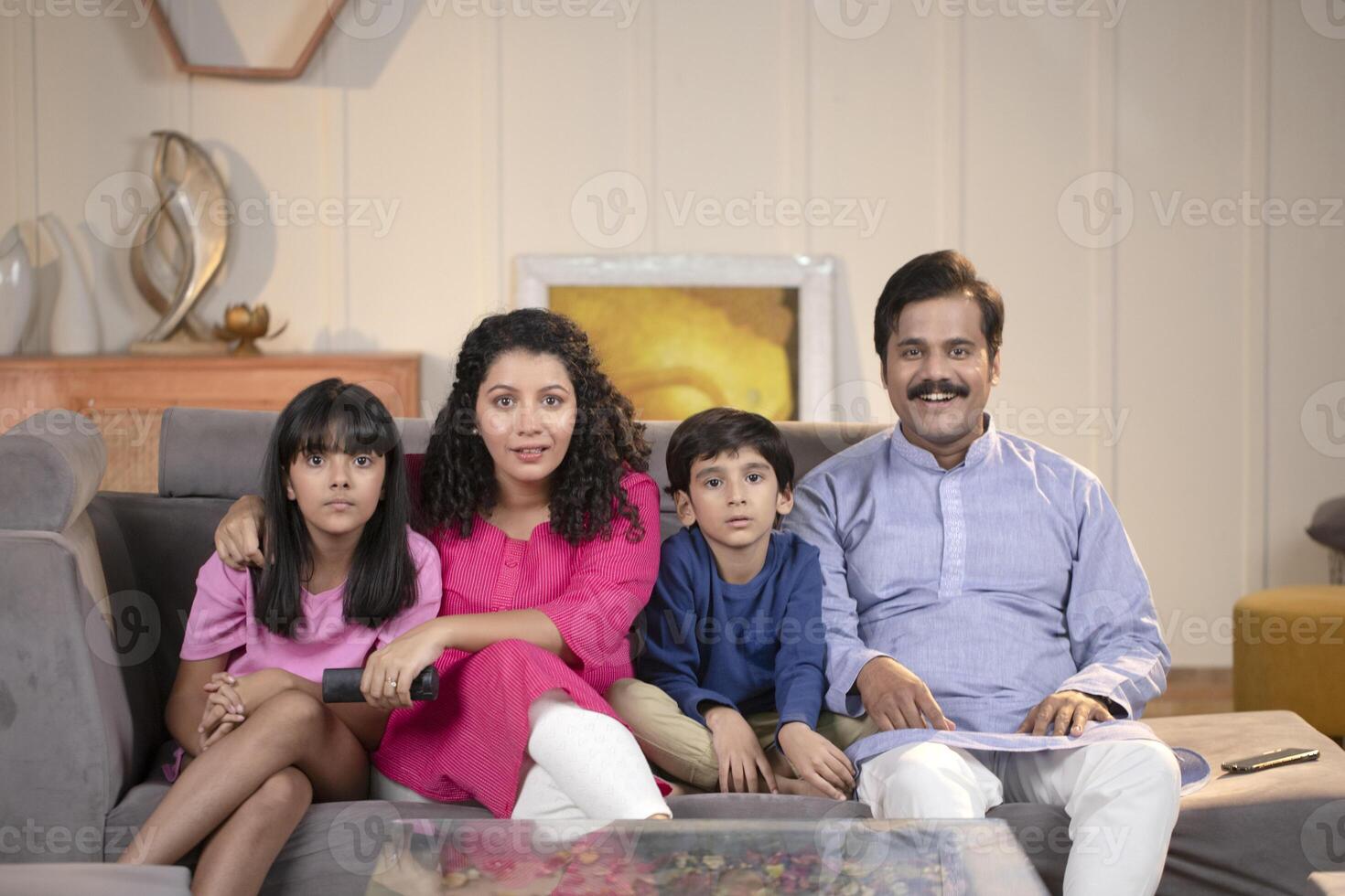 Family Watching Television At Home photo