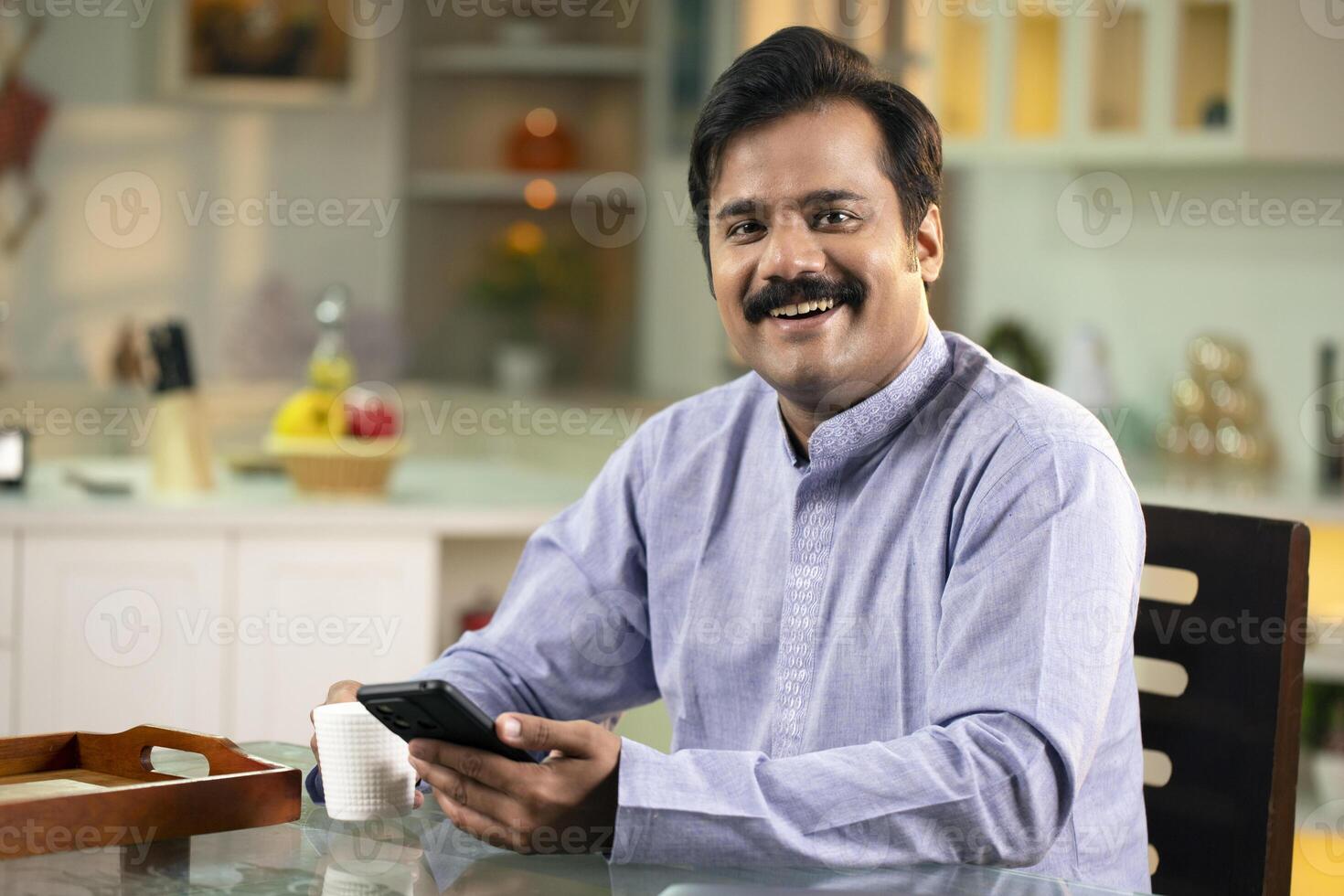 Man Smiling While Looking At Camera photo