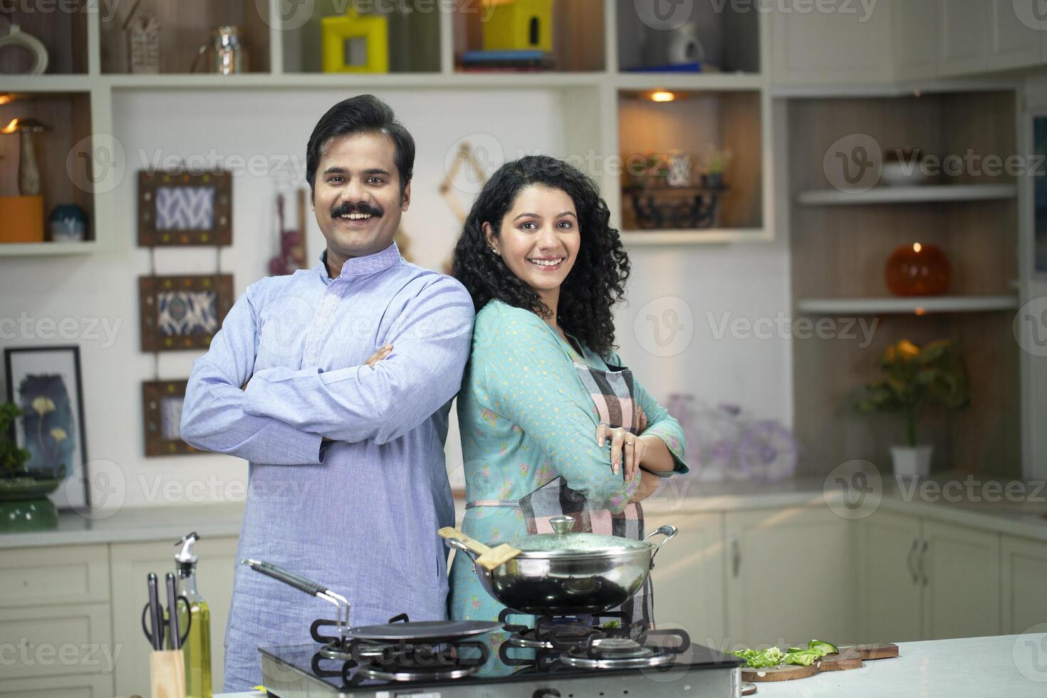 Couple Posing In Front Of The Camera At The Kitchen photo