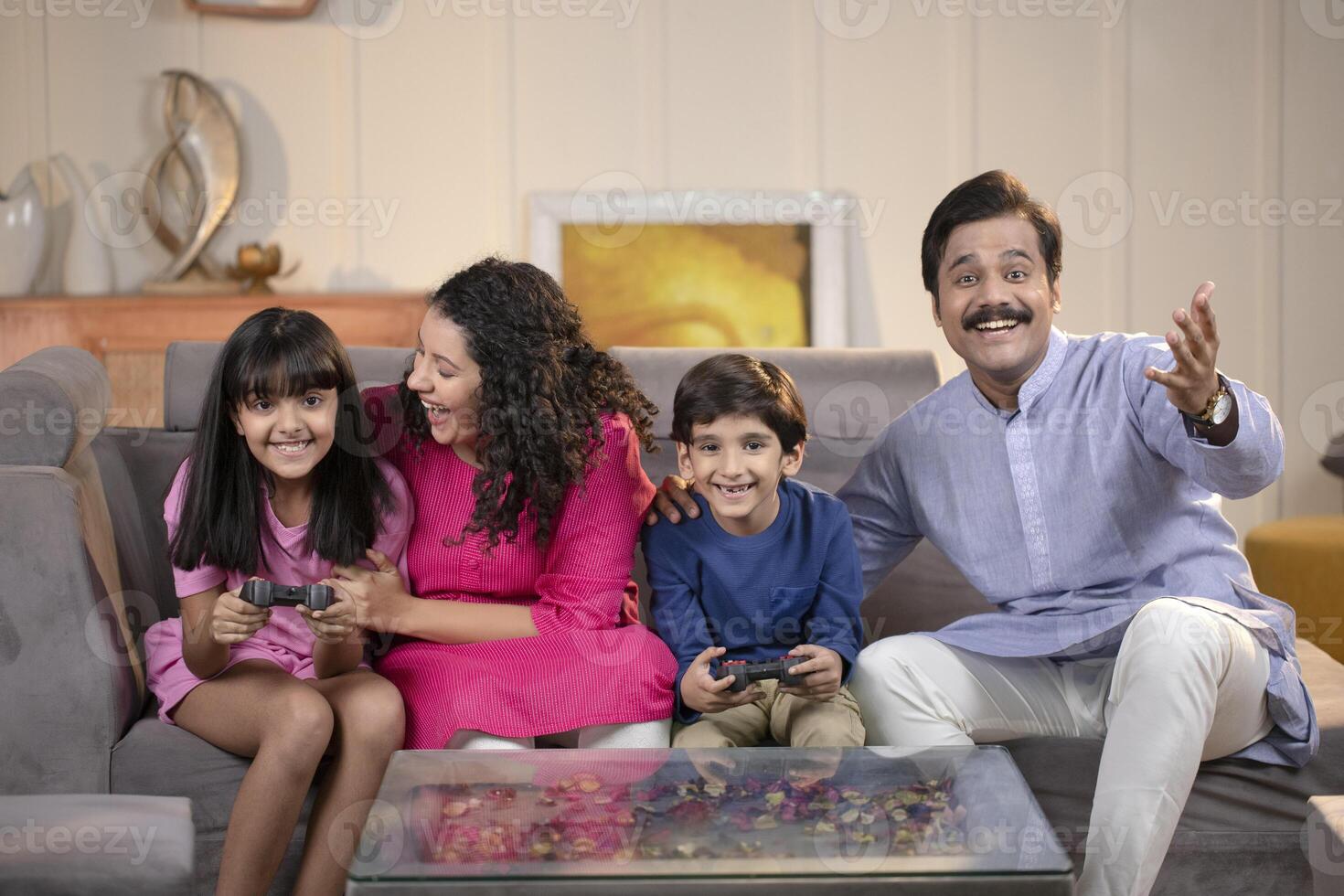 Sibling Playing Games At Home With Parents At Home photo
