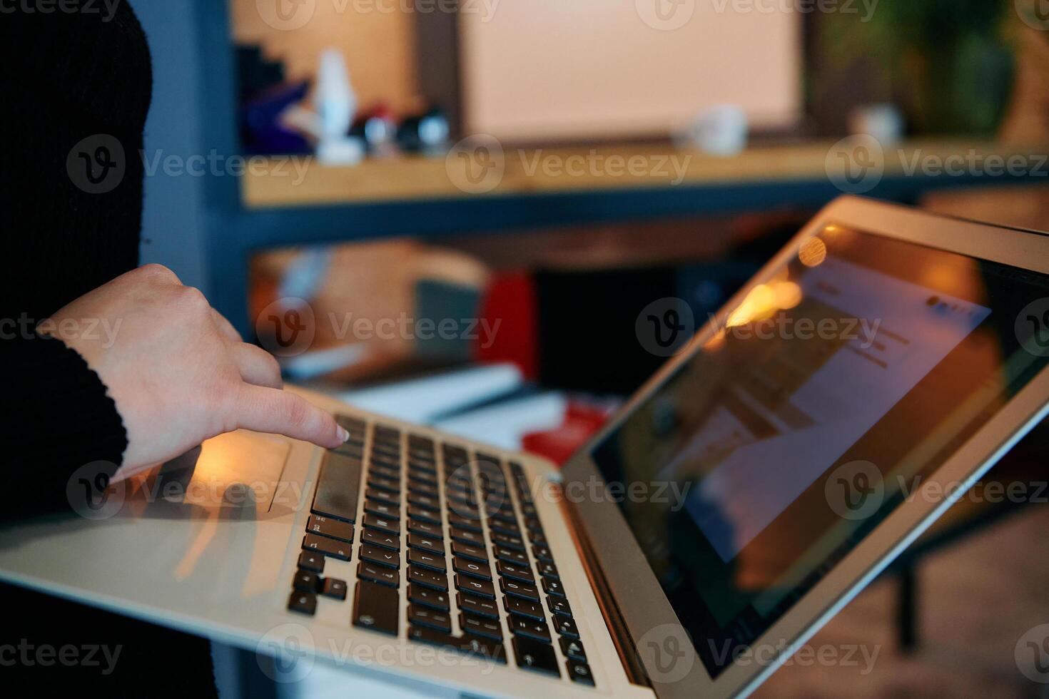 Close up of Hand Using Laptop in Office. photo