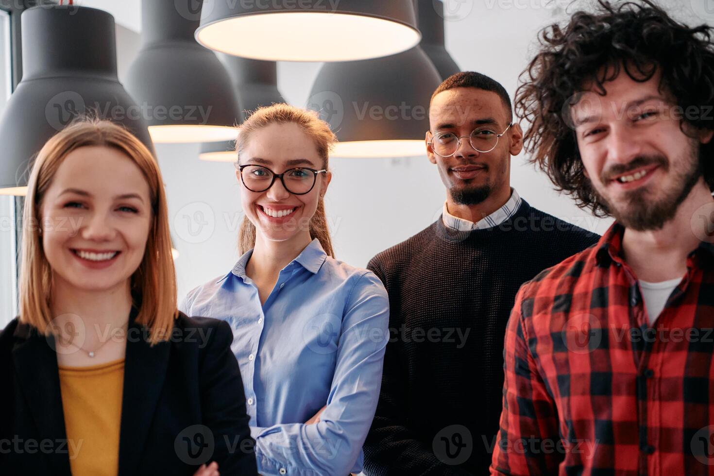 Diverse Business Team Standing United in Modern Office Ready for New Challenges. photo