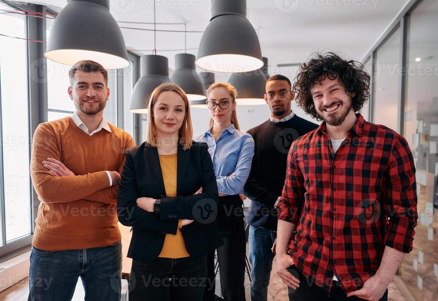 Diverse Business Team Standing United in Modern Office Ready for New Challenges. photo