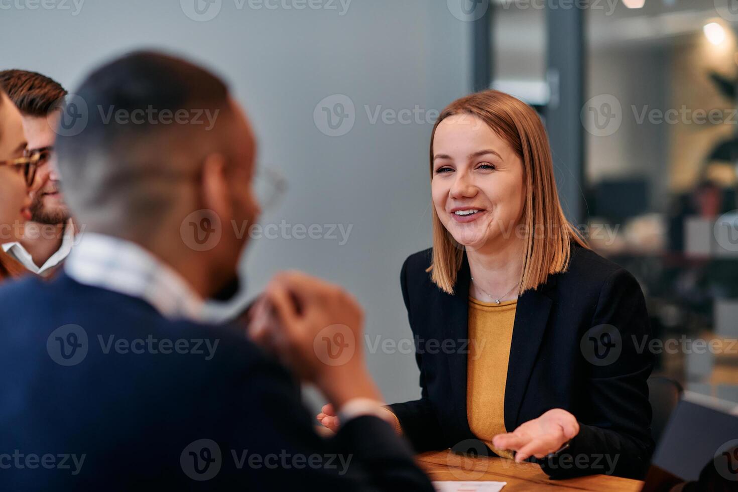 Businesswoman Leading Discussion in Modern Office Setting photo