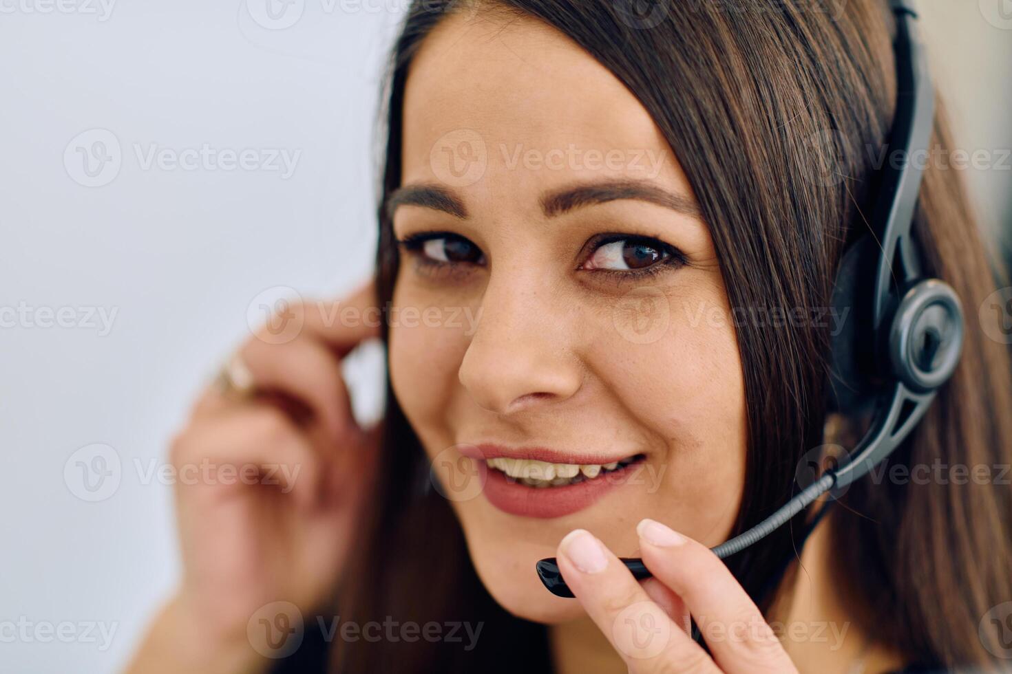 Friendly Call Center Agent Answering Incoming Calls with Headset Providing Remote Customer Service. photo