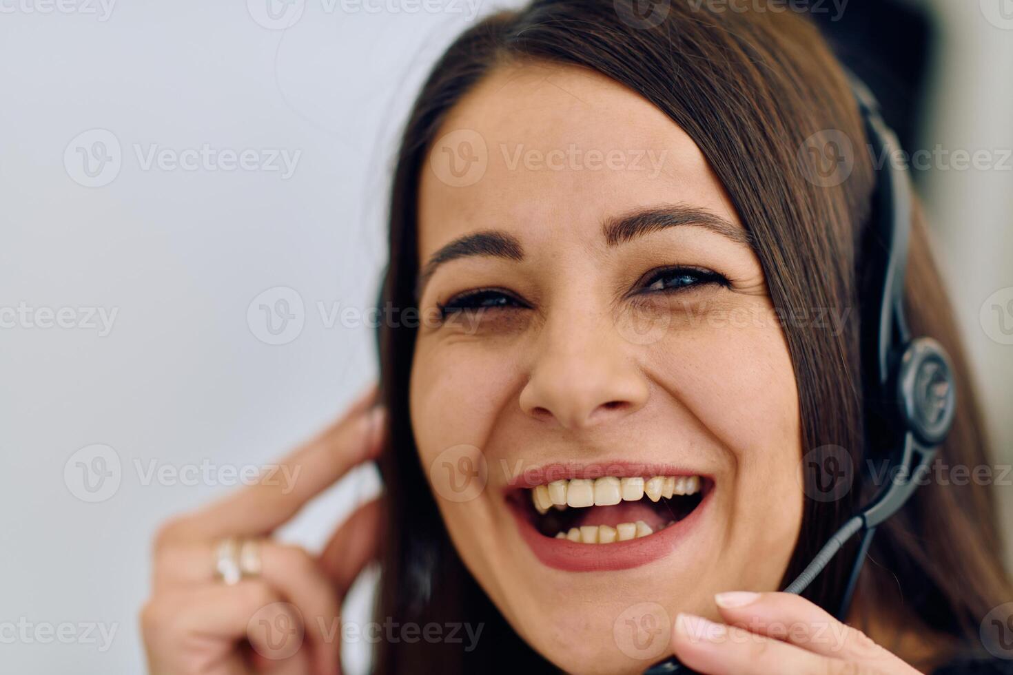 Friendly Call Center Agent Answering Incoming Calls with Headset Providing Remote Customer Service. photo