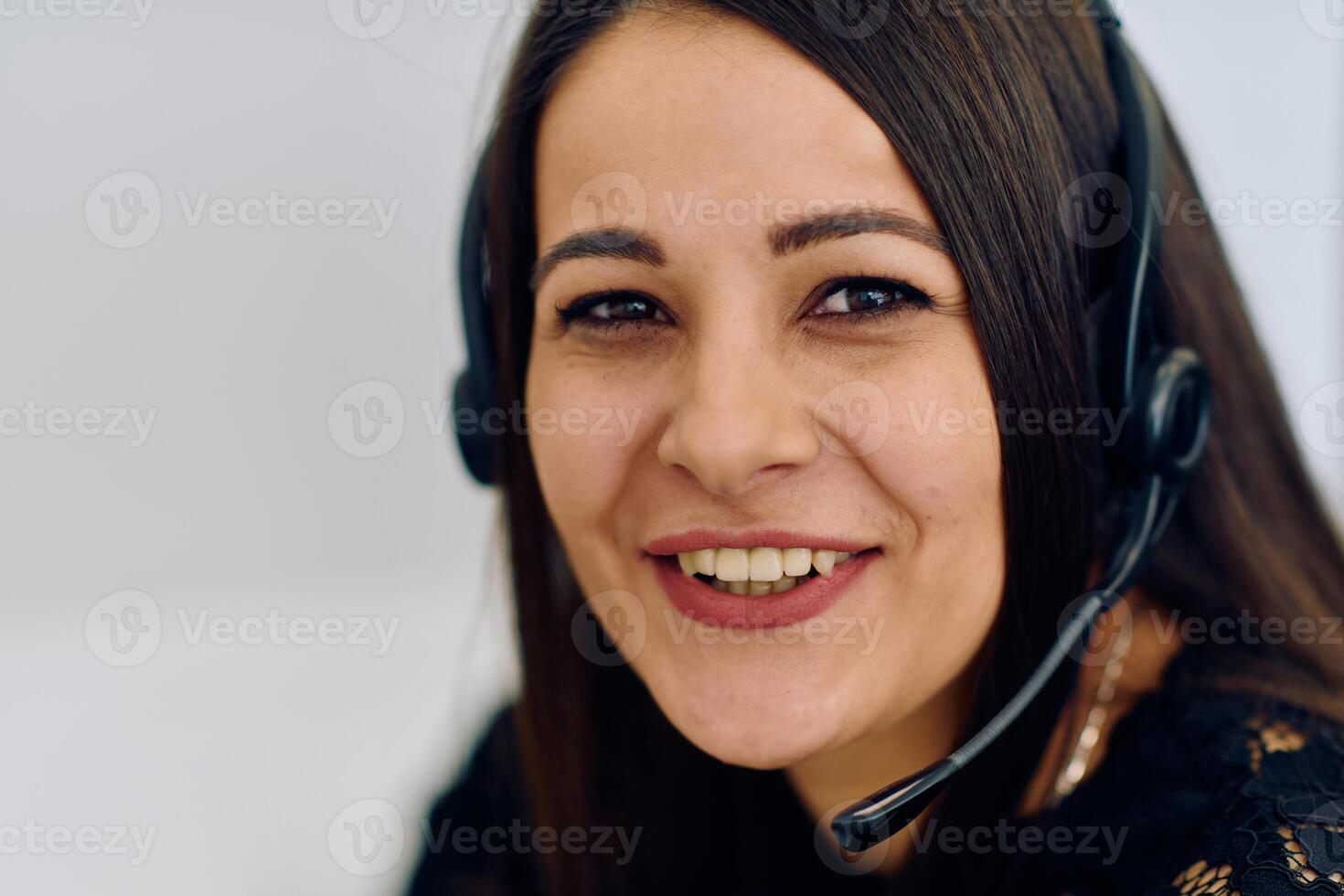 Friendly Call Center Agent Answering Incoming Calls with Headset Providing Remote Customer Service. photo