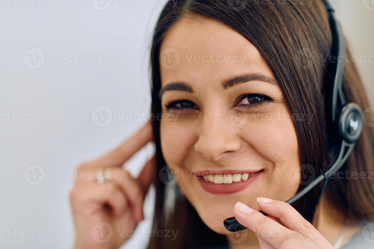 Friendly Call Center Agent Answering Incoming Calls with Headset Providing Remote Customer Service. photo