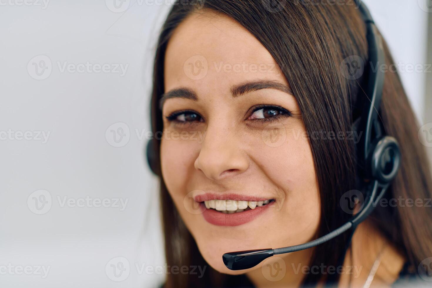 Friendly Call Center Agent Answering Incoming Calls with Headset Providing Remote Customer Service. photo