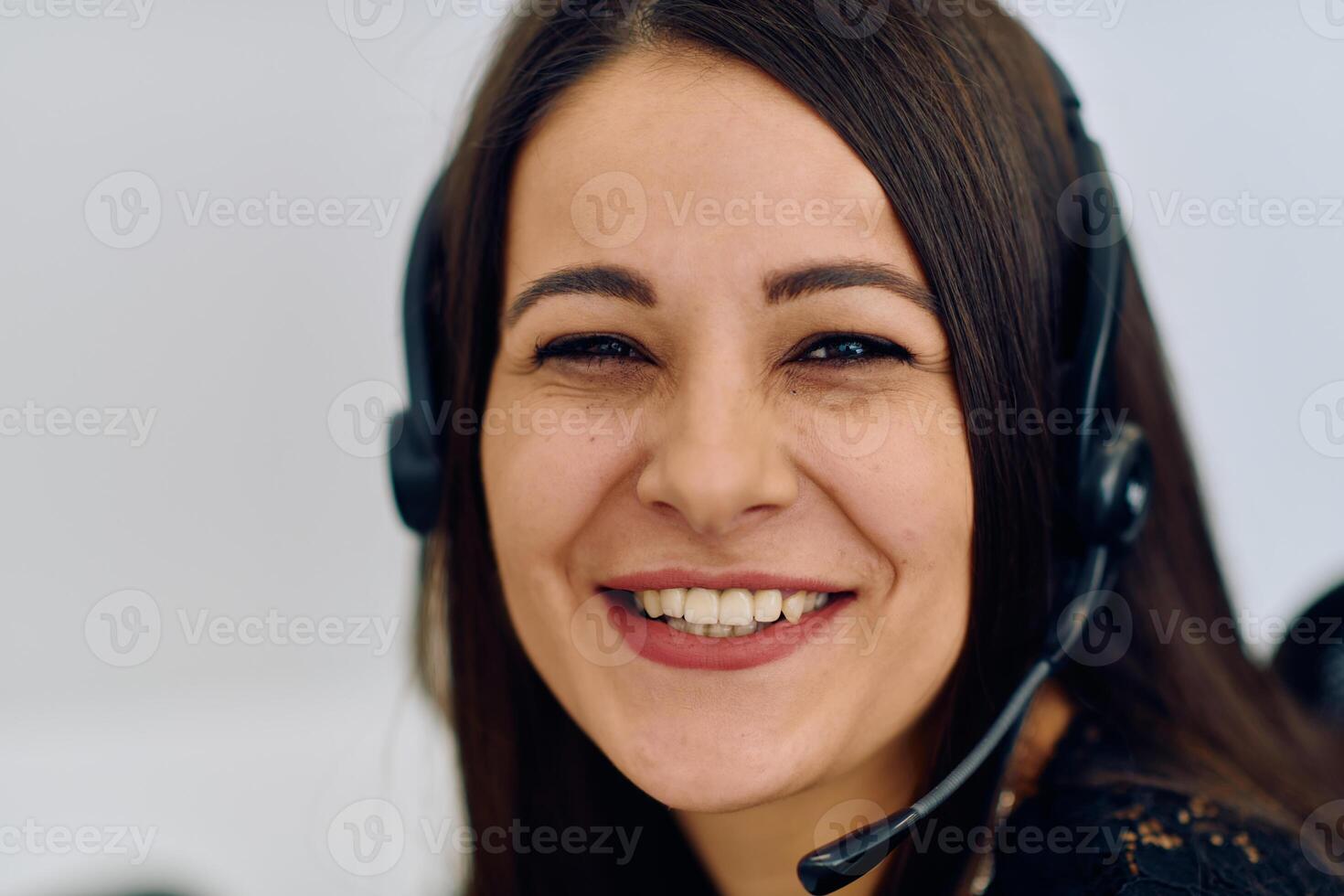 Friendly Call Center Agent Answering Incoming Calls with Headset Providing Remote Customer Service. photo