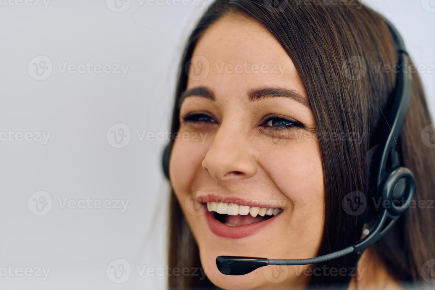 Friendly Call Center Agent Answering Incoming Calls with Headset Providing Remote Customer Service. photo