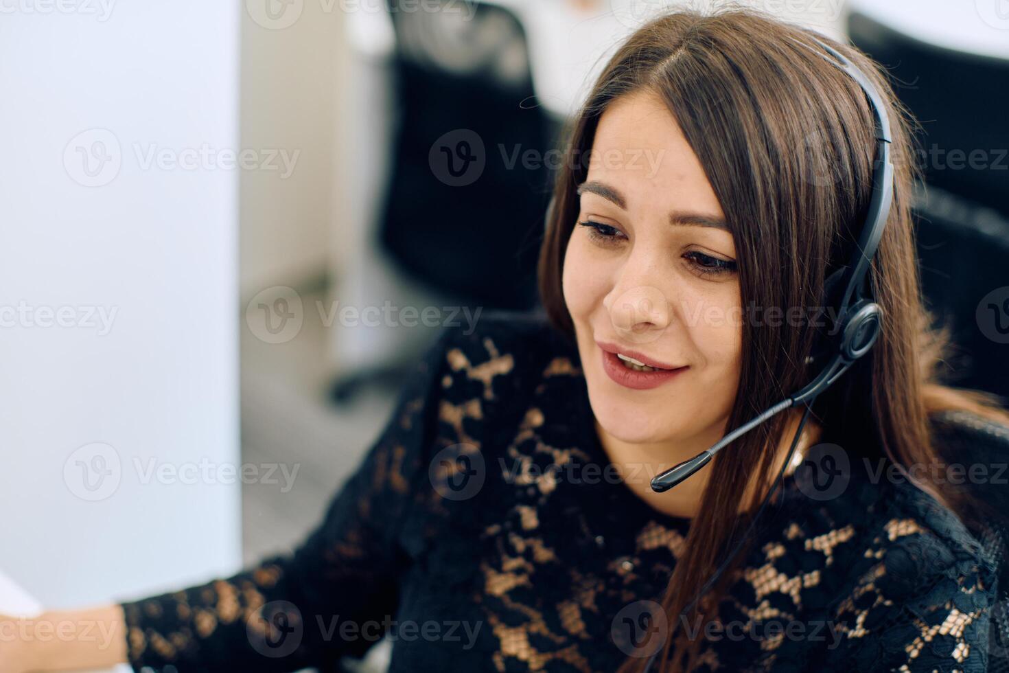 Friendly Call Center Agent Answering Incoming Calls with Headset Providing Remote Customer Service. photo