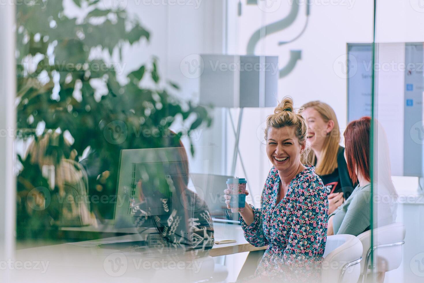 Business Team of Women Discussing New Topics and Strategies to Improve Client Operations. photo