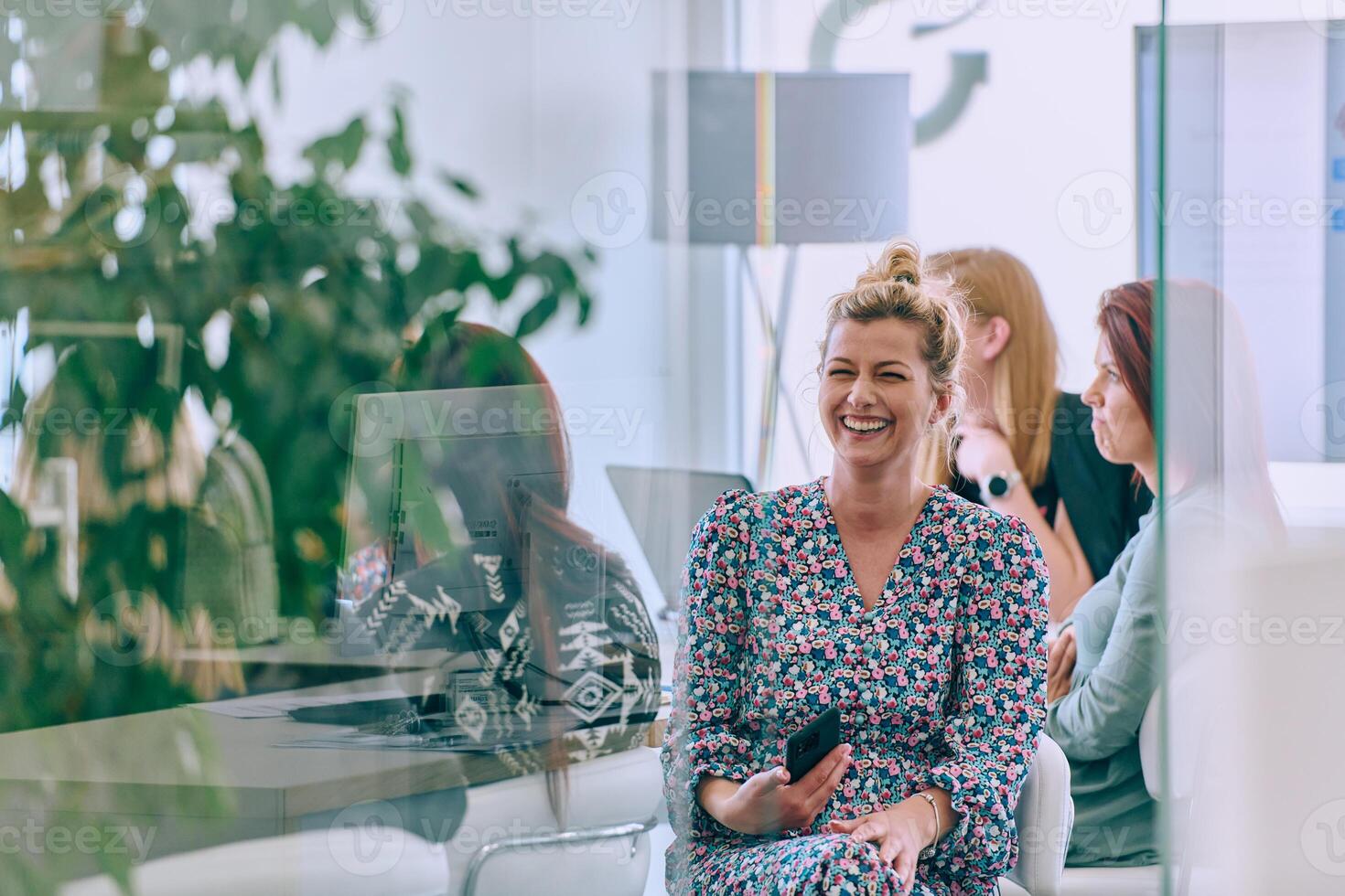 Business Team of Women Discussing New Topics and Strategies to Improve Client Operations. photo