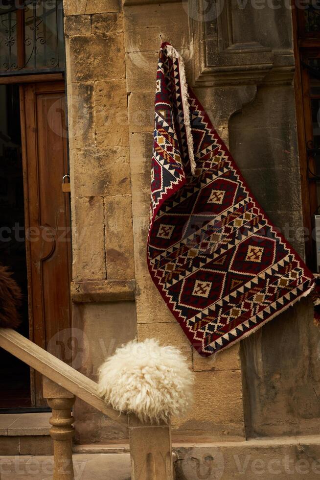 National carpets with Caucasian patterns are for sale in the old town photo