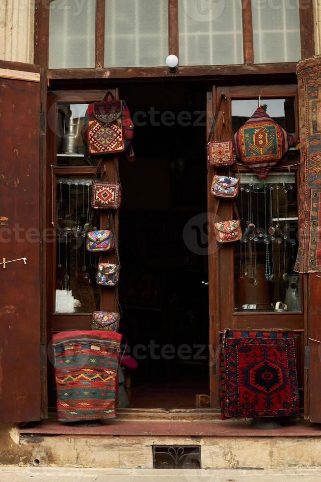 National carpets with Caucasian patterns are for sale in the old town photo