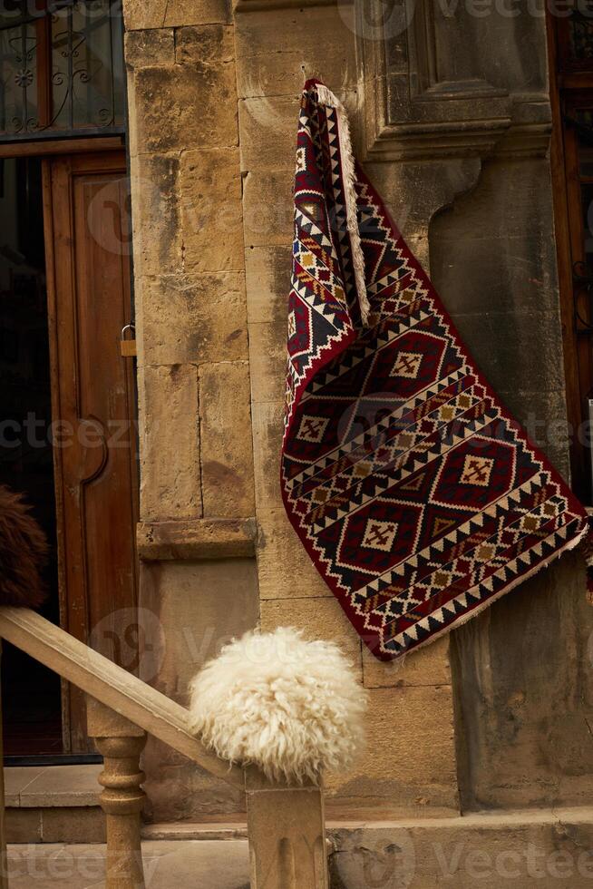 National carpets with Caucasian patterns are for sale in the old town photo