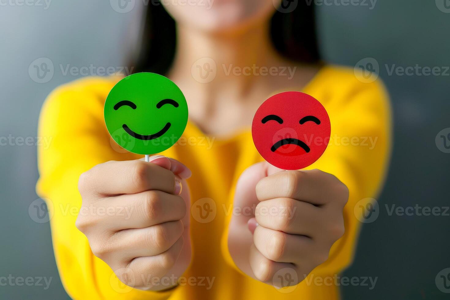 Contrasting Emotions Hands Holding Red and Green Sad Face Icons for Feedback and Customer Satisfaction. photo