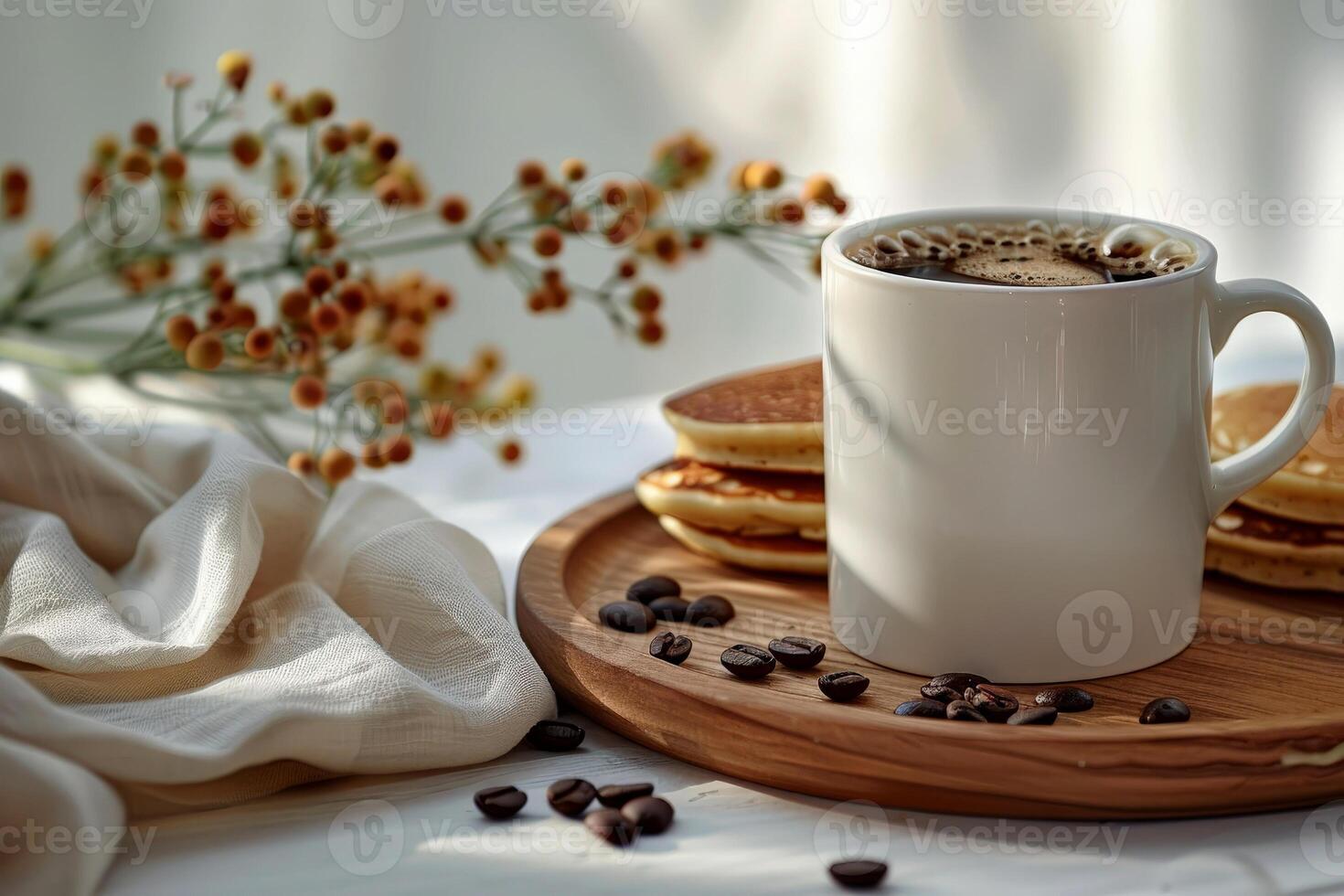 A cup of coffee with pancakes for mockup on a table with coffee beans scattered around it. photo