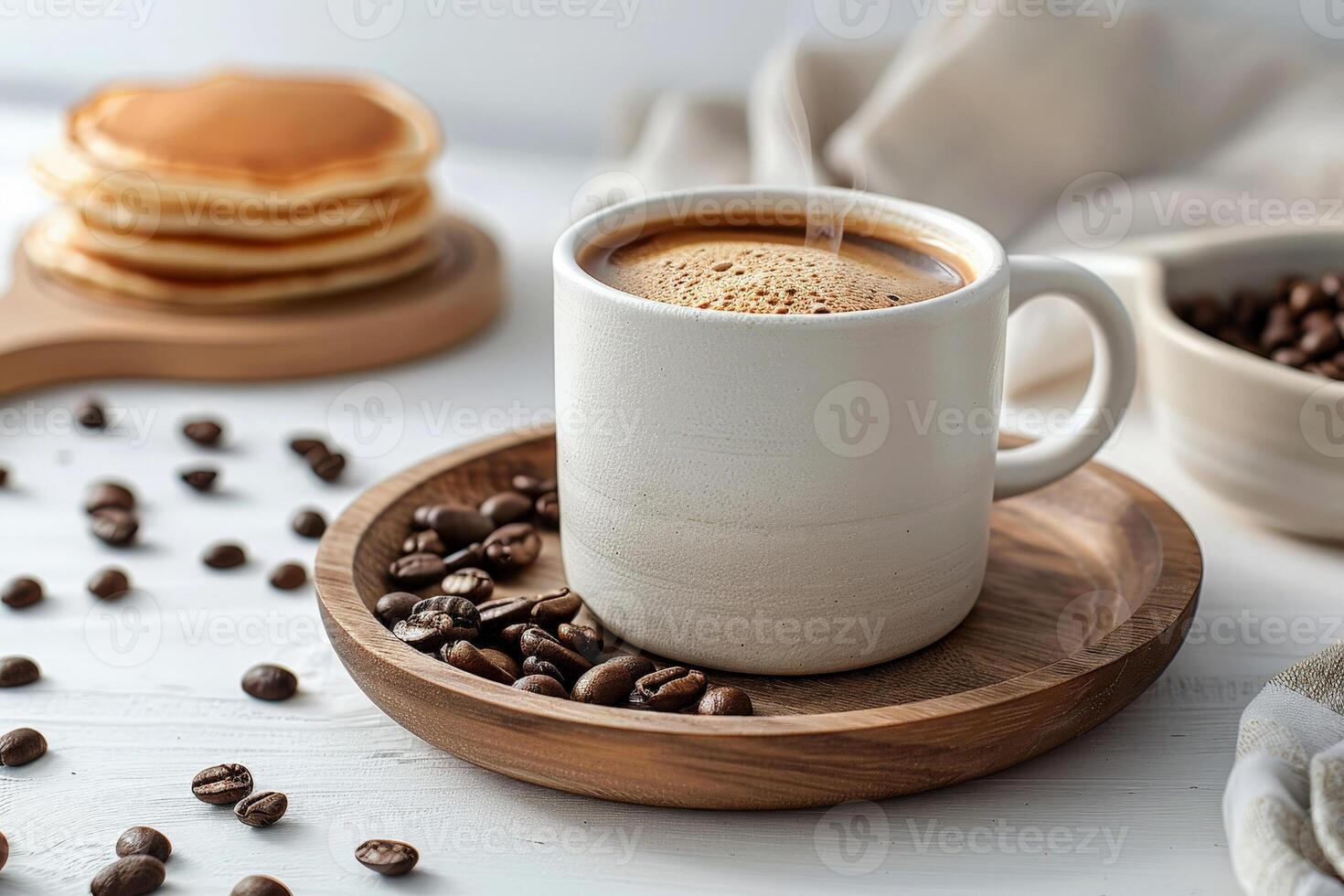 A cup of coffee with pancakes for mockup on a table with coffee beans scattered around it. photo