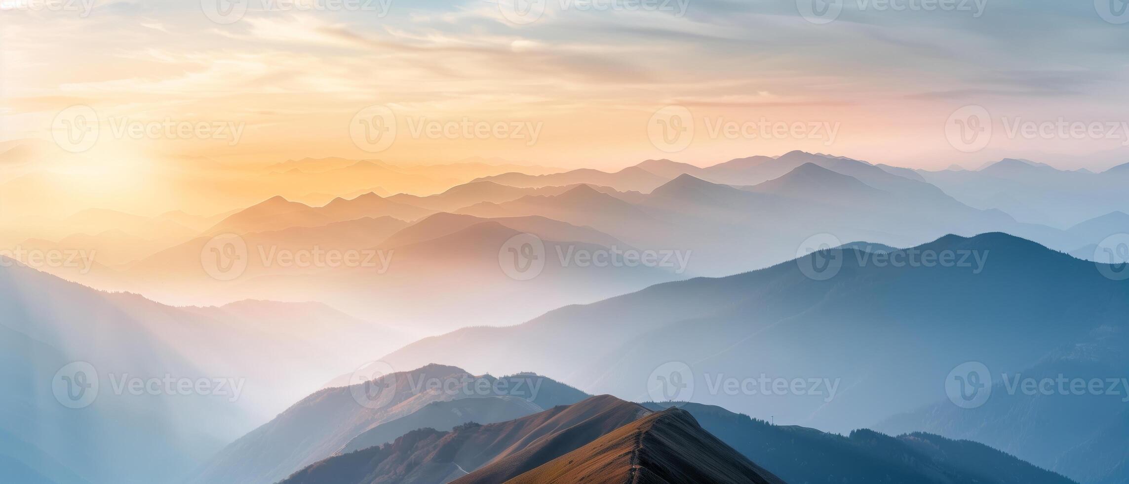 Breathtaking sunrise over misty mountains creating a serene, peaceful, and tranquil natural landscape scene perfect for relaxation and inspiration. photo