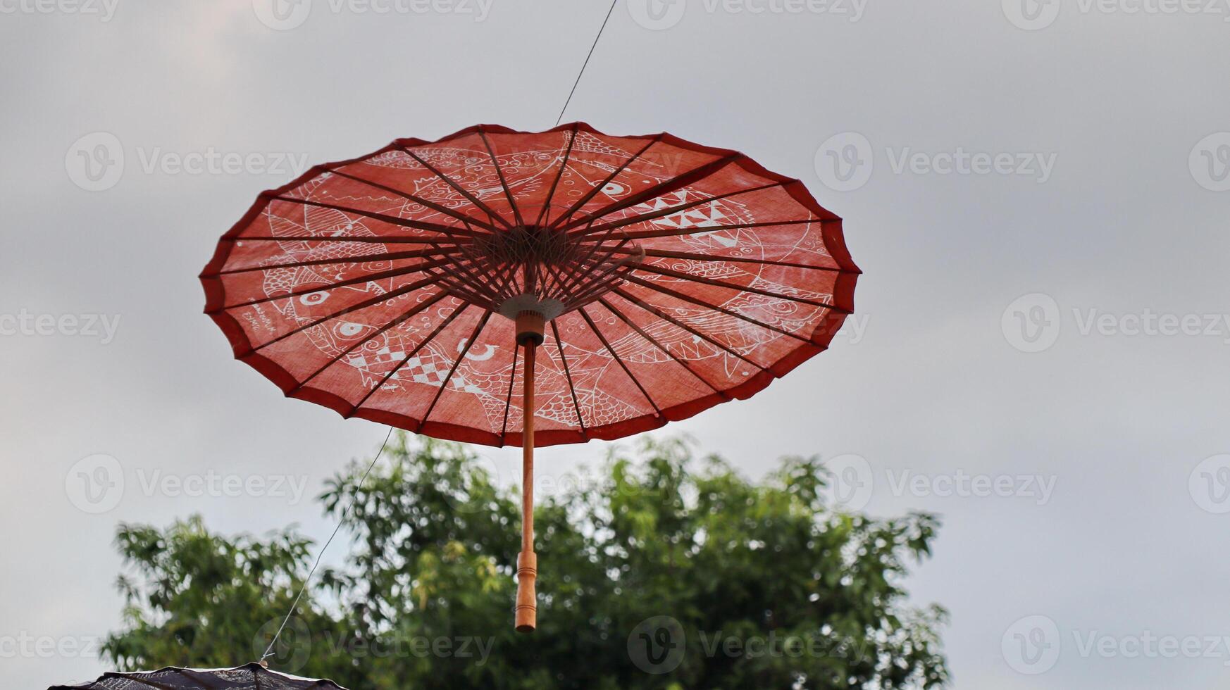 traditional wooden umbrella hanging against the sky background photo