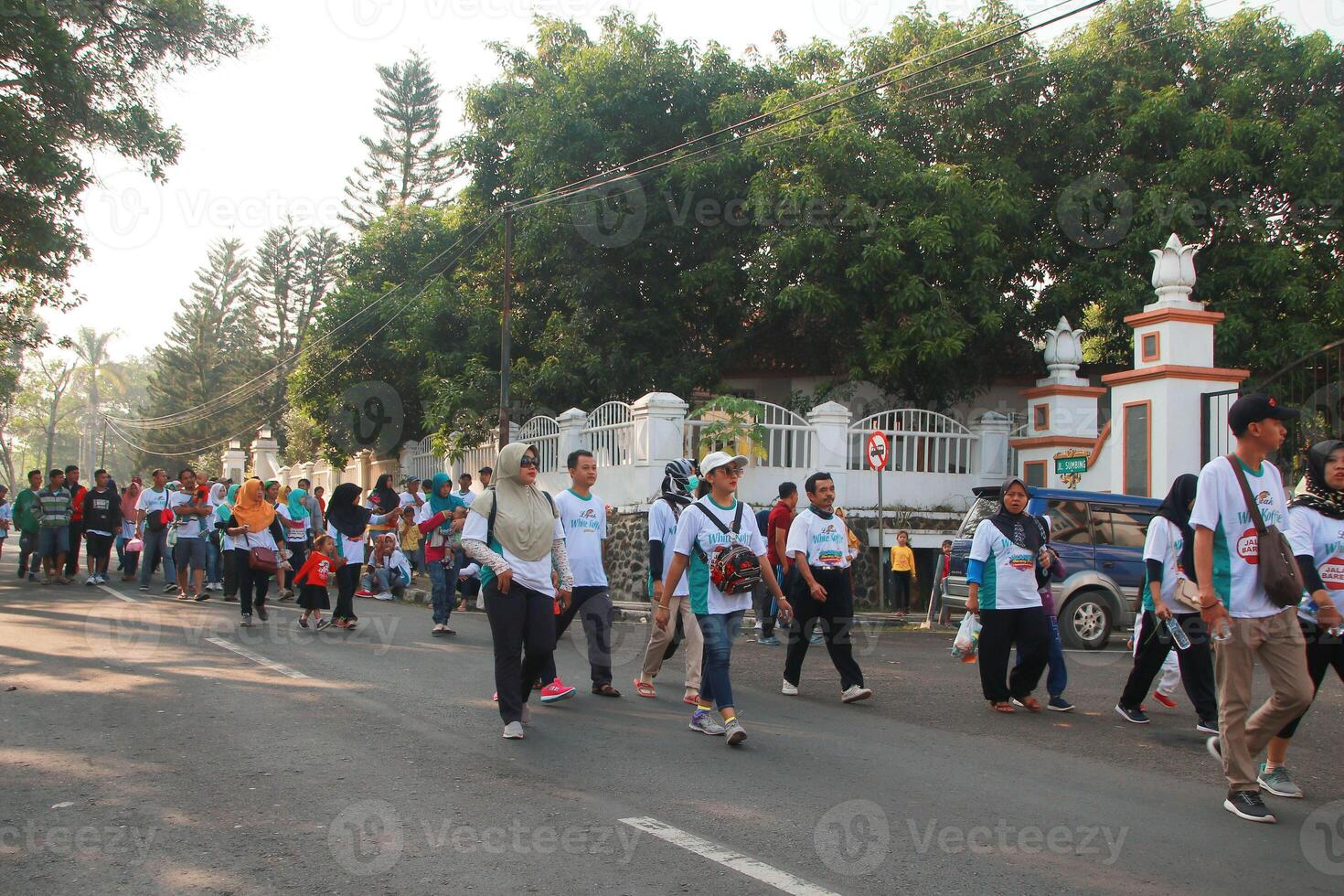 People exercise together in the park happily photo