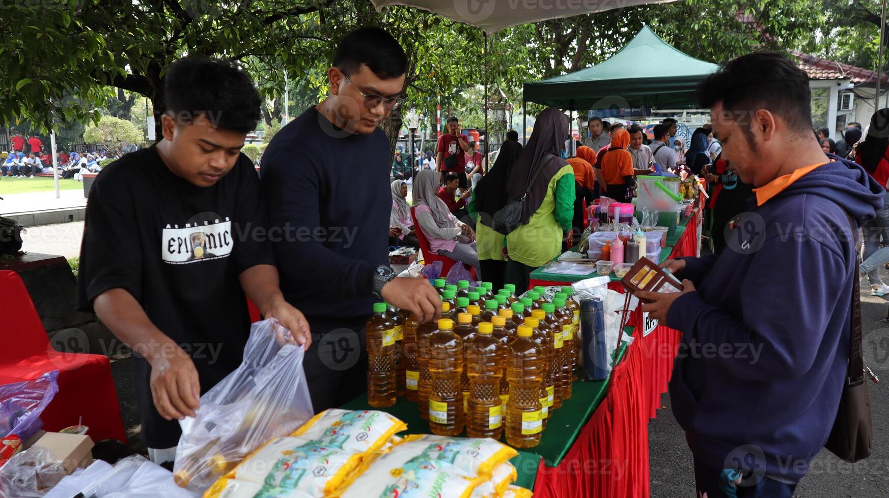 Yellow palm cooking oil in packaged bottles sold in shopping centres photo