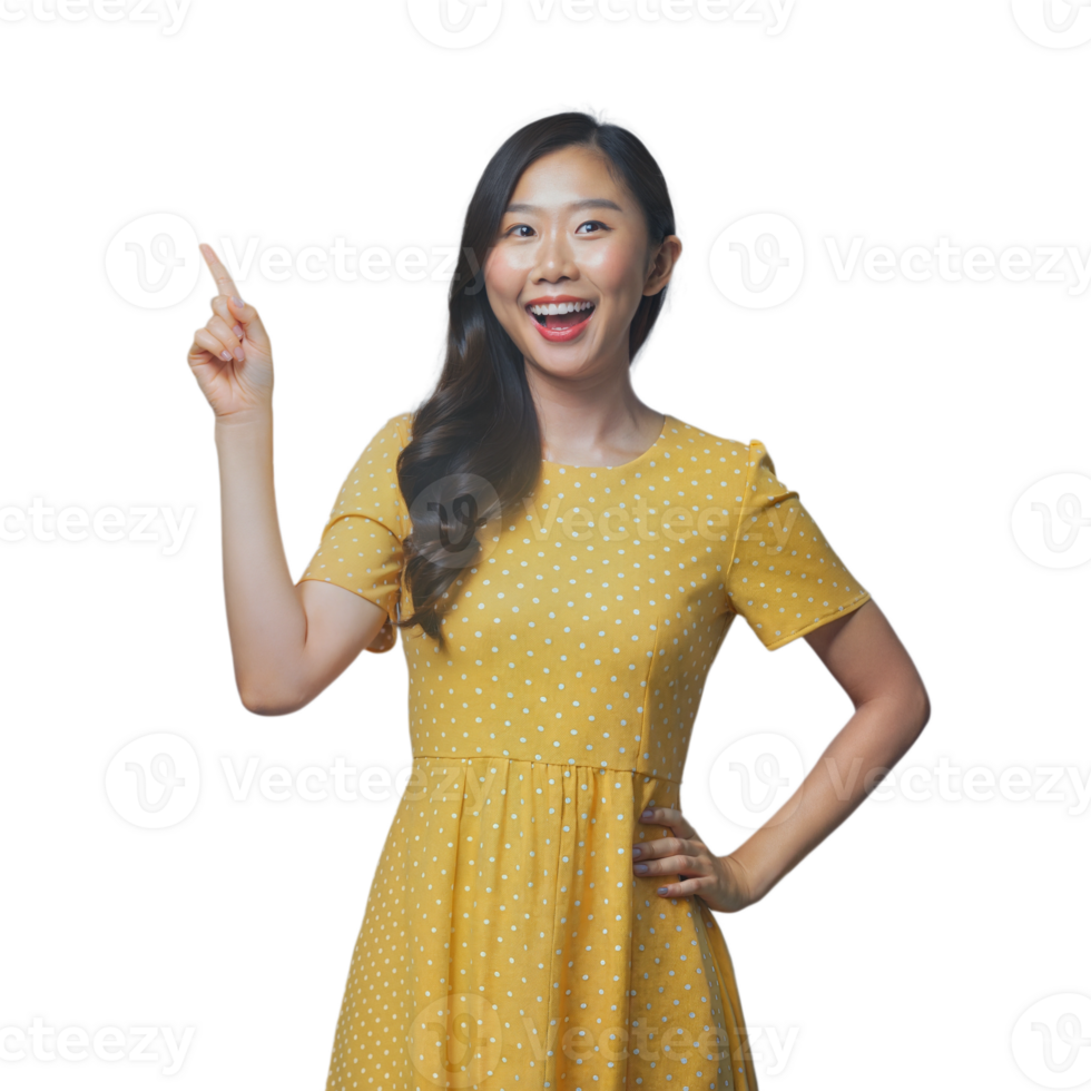 Young Woman in Yellow Polka Dot Dress Pointing Upwards With a Smile png