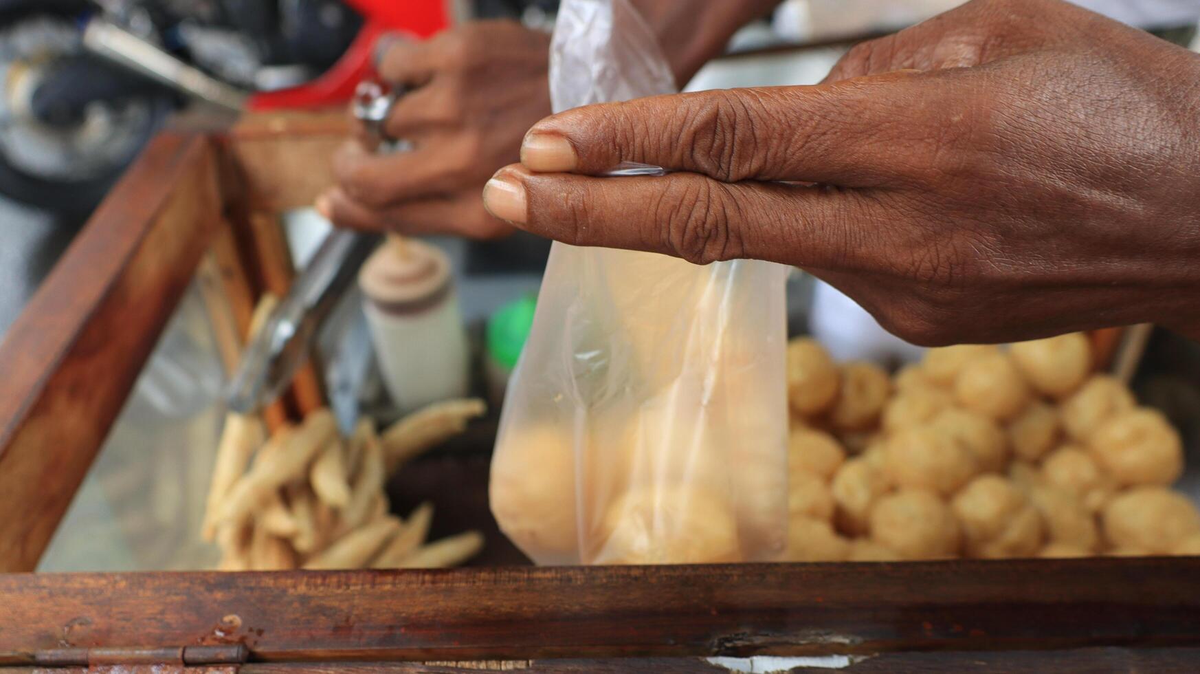 Indonesian street food vendor sell Round tofu known as Tahu Bulat photo