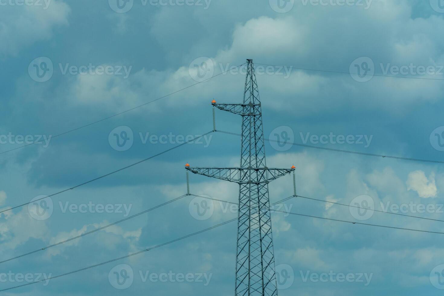 High voltage towers with sky background. Power line support with wires for electricity transmission. High voltage grid tower with wire cable at distribution station. Energy industry, energy saving photo
