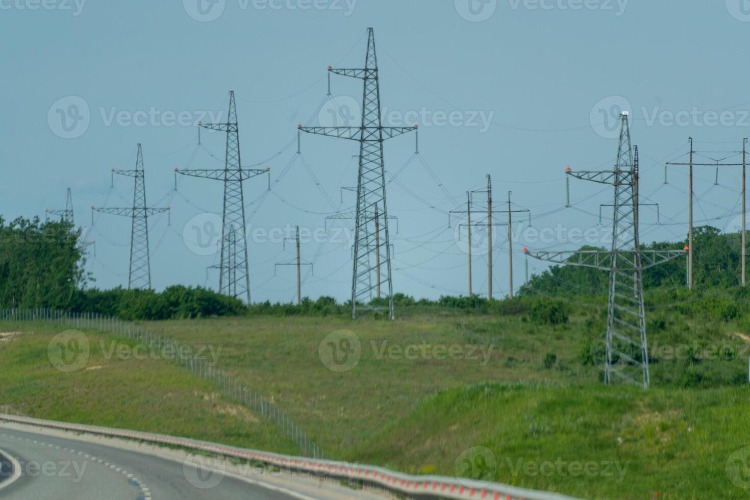 High voltage towers with sky background. Power line support with wires for electricity transmission. High voltage grid tower with wire cable at distribution station. Energy industry, energy saving photo