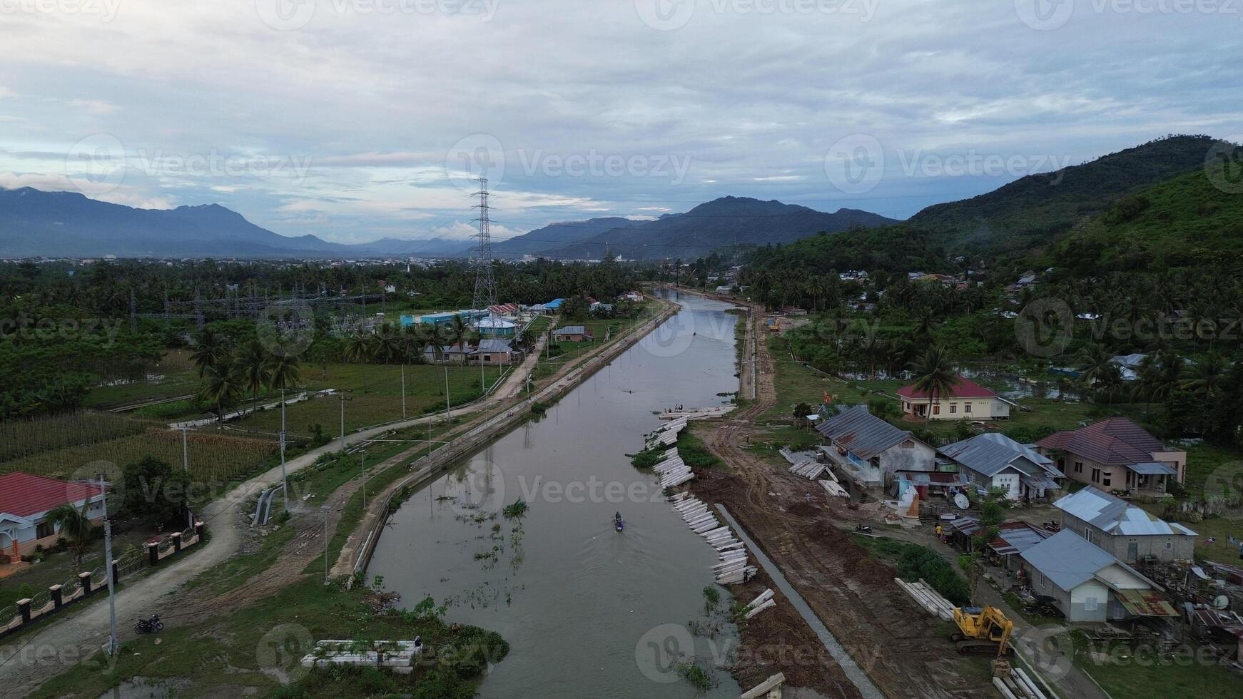 Aerial view of river and village in the evening in Gorontalo, Indonesia photo