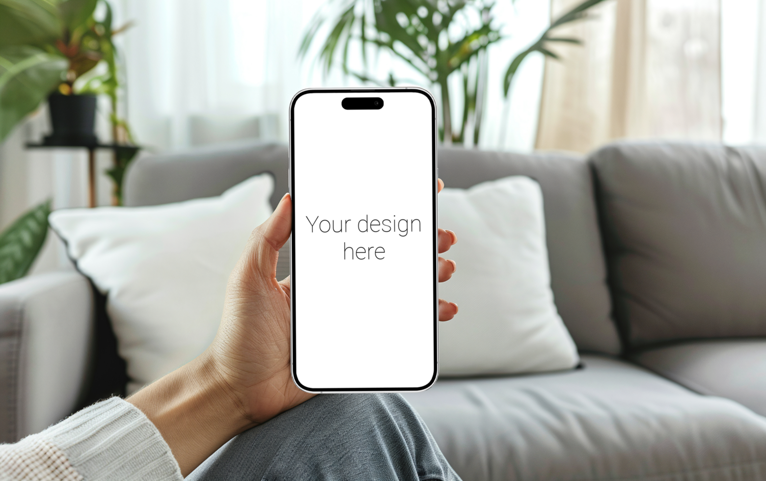 Mockup of white smartphone similar to iphone 15 in person's hand. Person sitting on the sofa psd