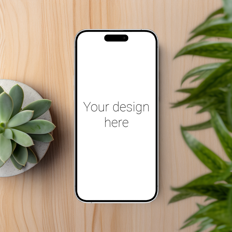 Mockup of white smartphone similar to iphone on table. Plants nearby psd