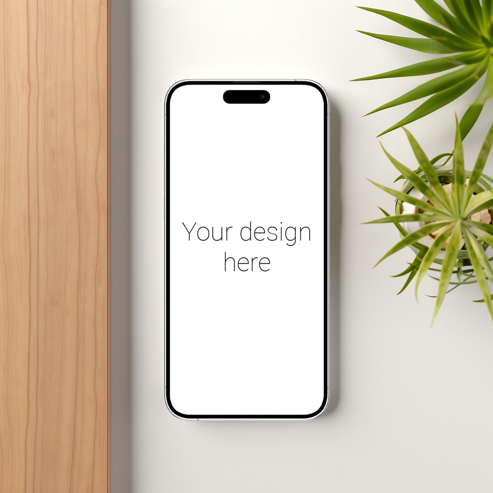Mockup of white smartphone similar to iphone on table. Plants nearby psd