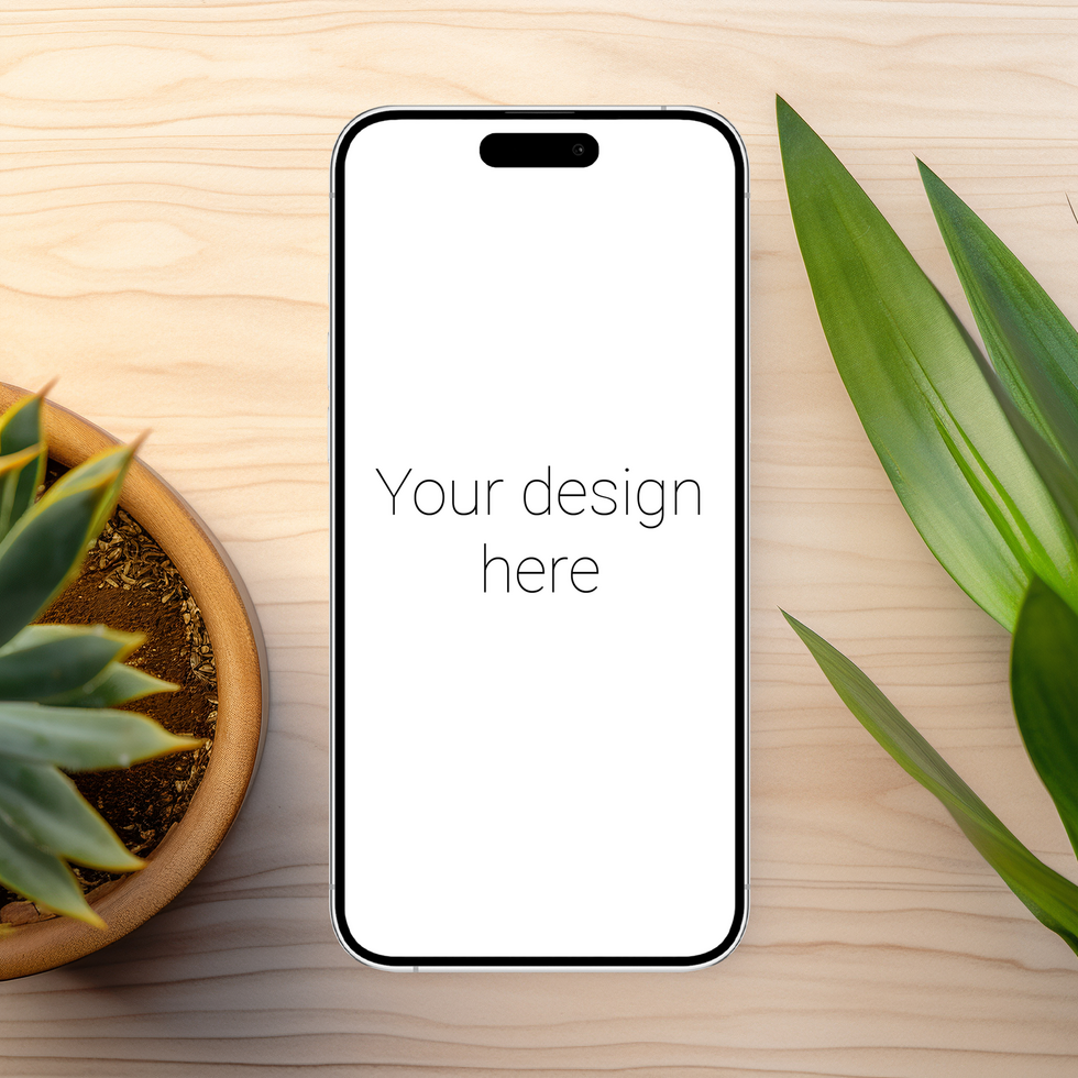 Mockup of white smartphone similar to iphone on table. Plants nearby psd