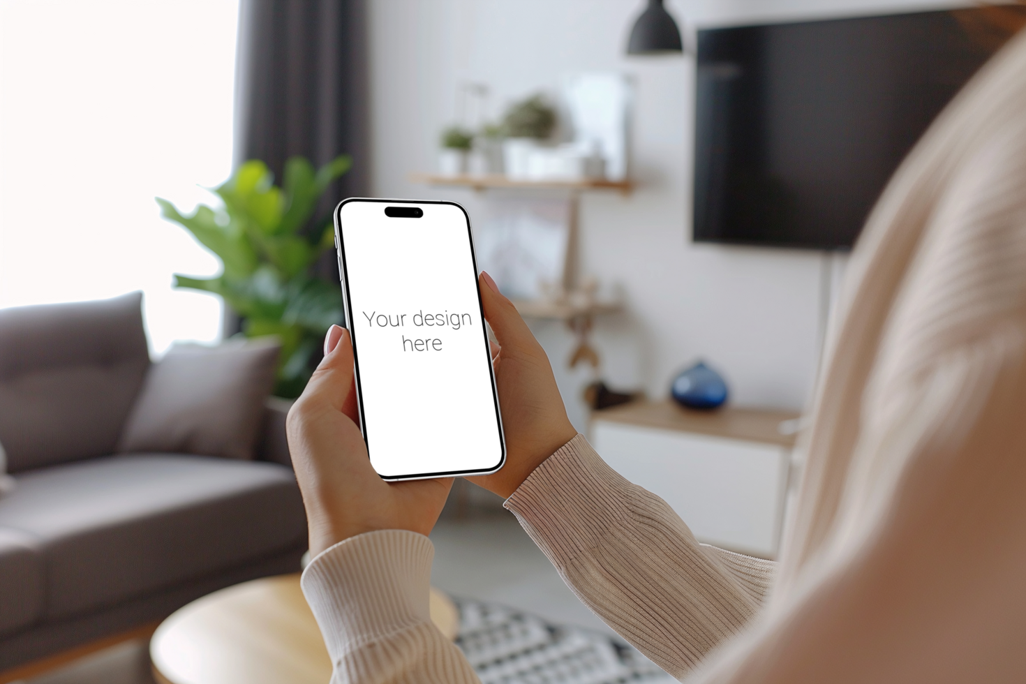 Mockup of white smartphone similar to iphone 15 in person's hand. Person sitting on the sofa psd