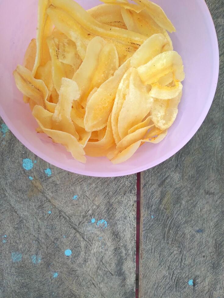 keripik pisang or banana chips is one of type traditional dry snack from indonesia photo