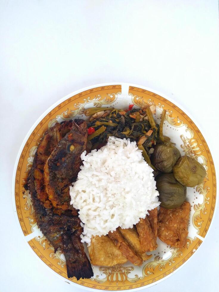 A closeup view of grilled white fish, in a restaurant or kitchen setting. photo
