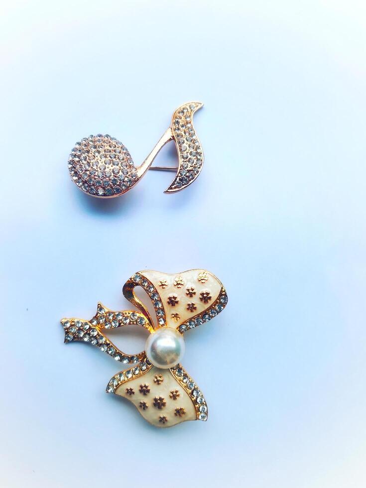 Accessories shaped like butterflies and melodies in yellow and white with imitation gems are suitable for use at events and add to the elegance of women. on white background photo