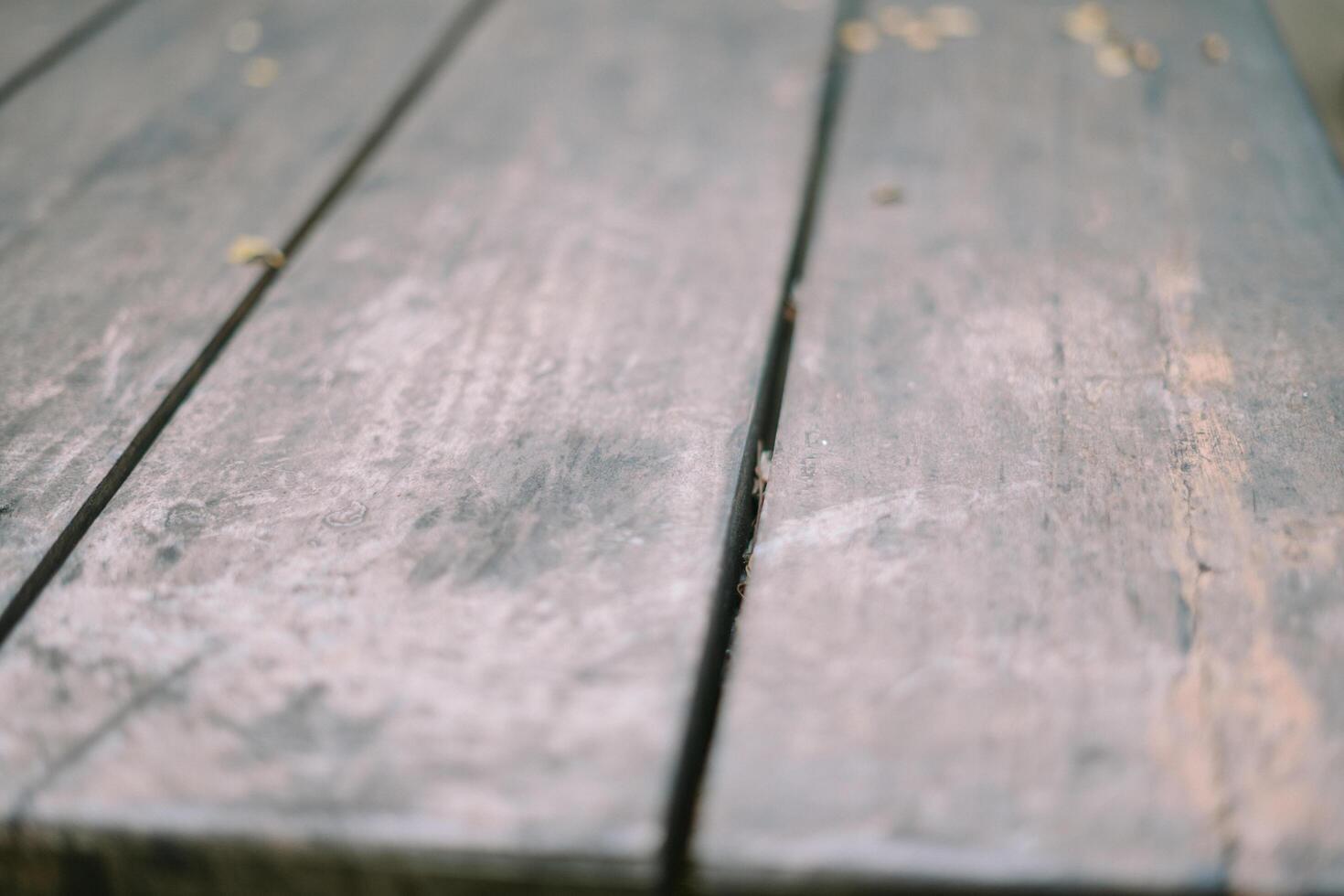 A weathered yet sturdy wooden table structure displays a blend of rustic charm and durability photo