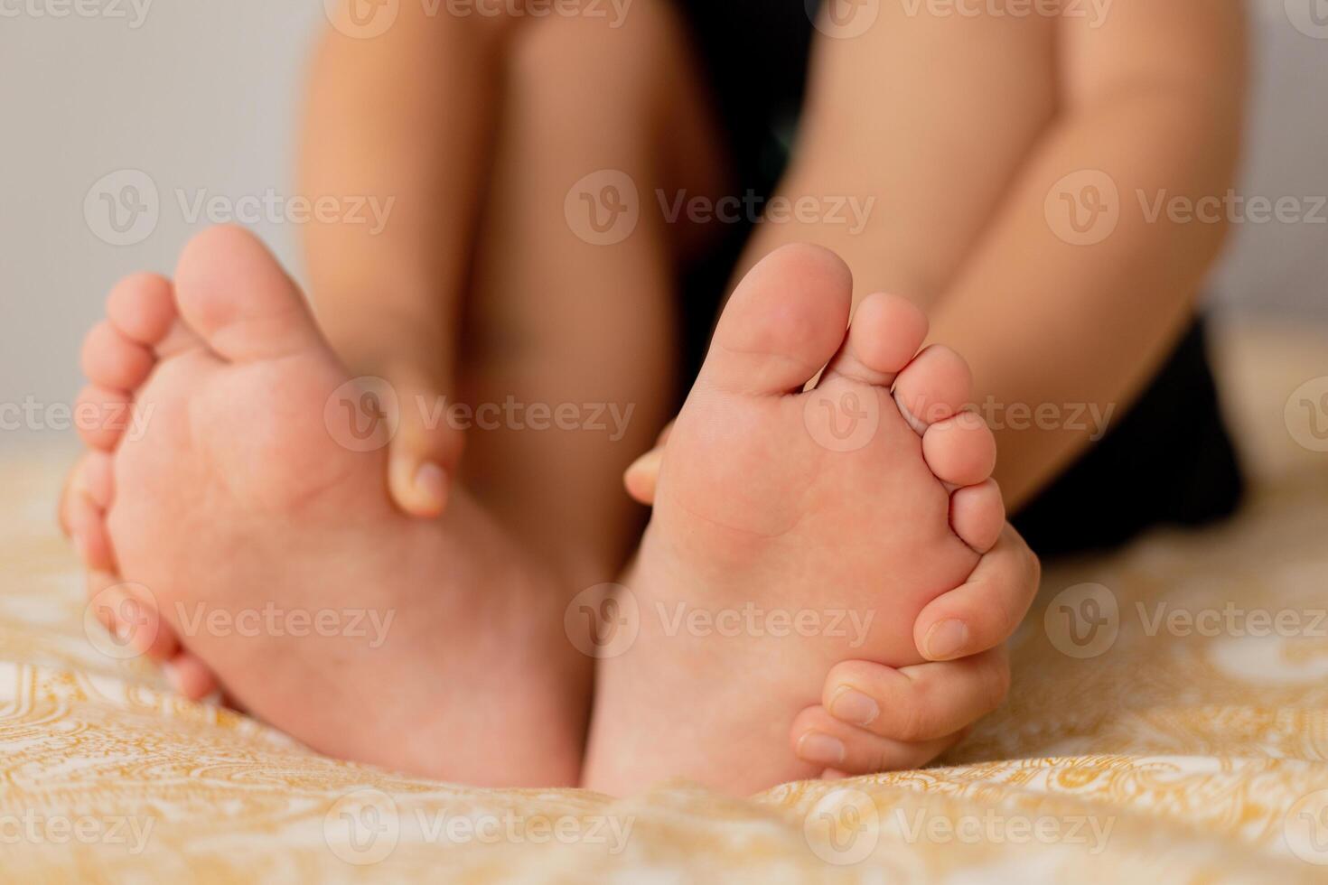Close-up view of kid's feet. Child foot care, hygiene, correct footwear. Flat feet. Ideal for use in healthcare, pediatrics, and parenting-themed projects or advertisements. Foot problems, pain. photo