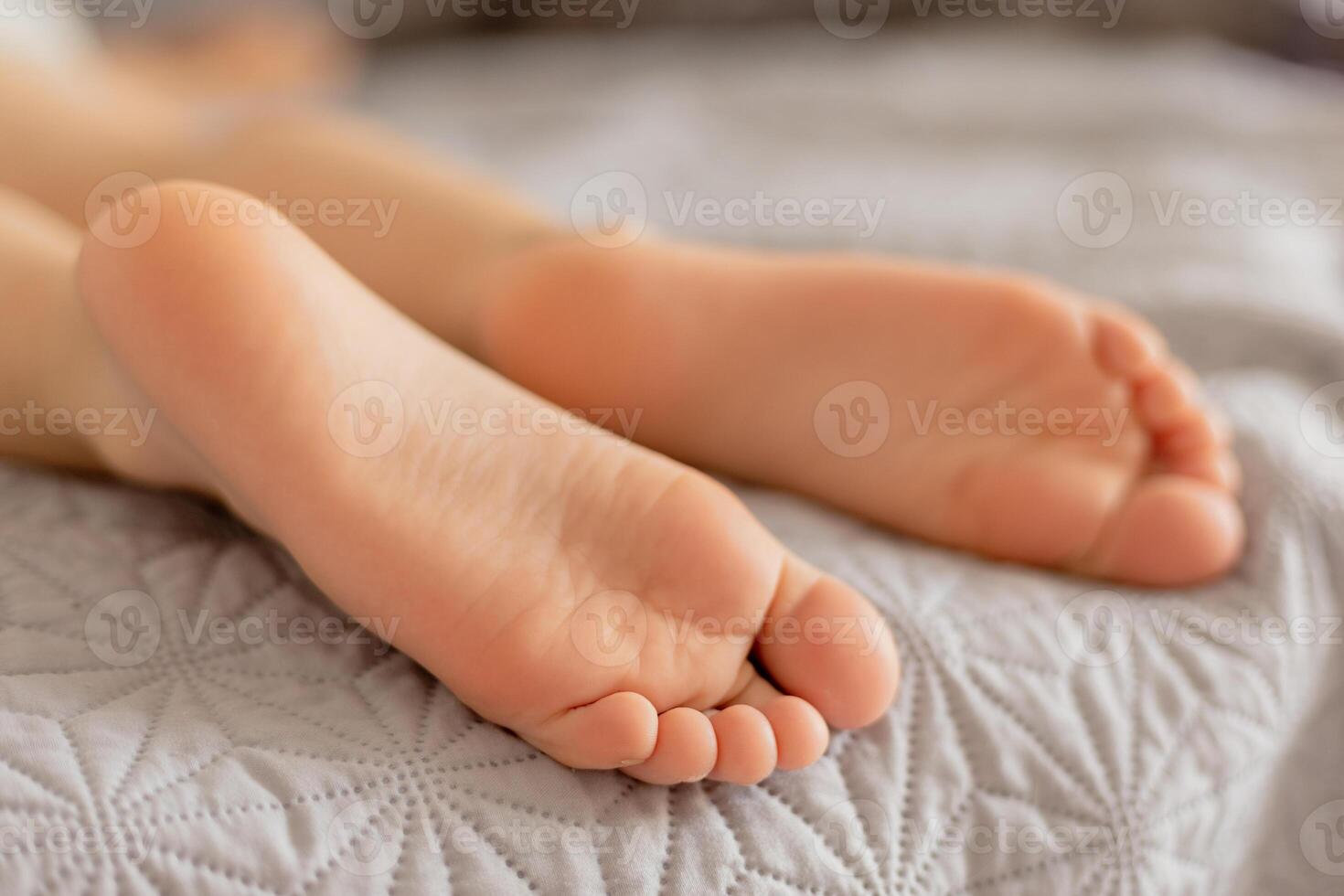 Close-up view of kid's feet. Child foot care, hygiene, correct footwear. Flat feet. Ideal for use in healthcare, pediatrics, and parenting-themed projects or advertisements. Foot problems, pain. photo
